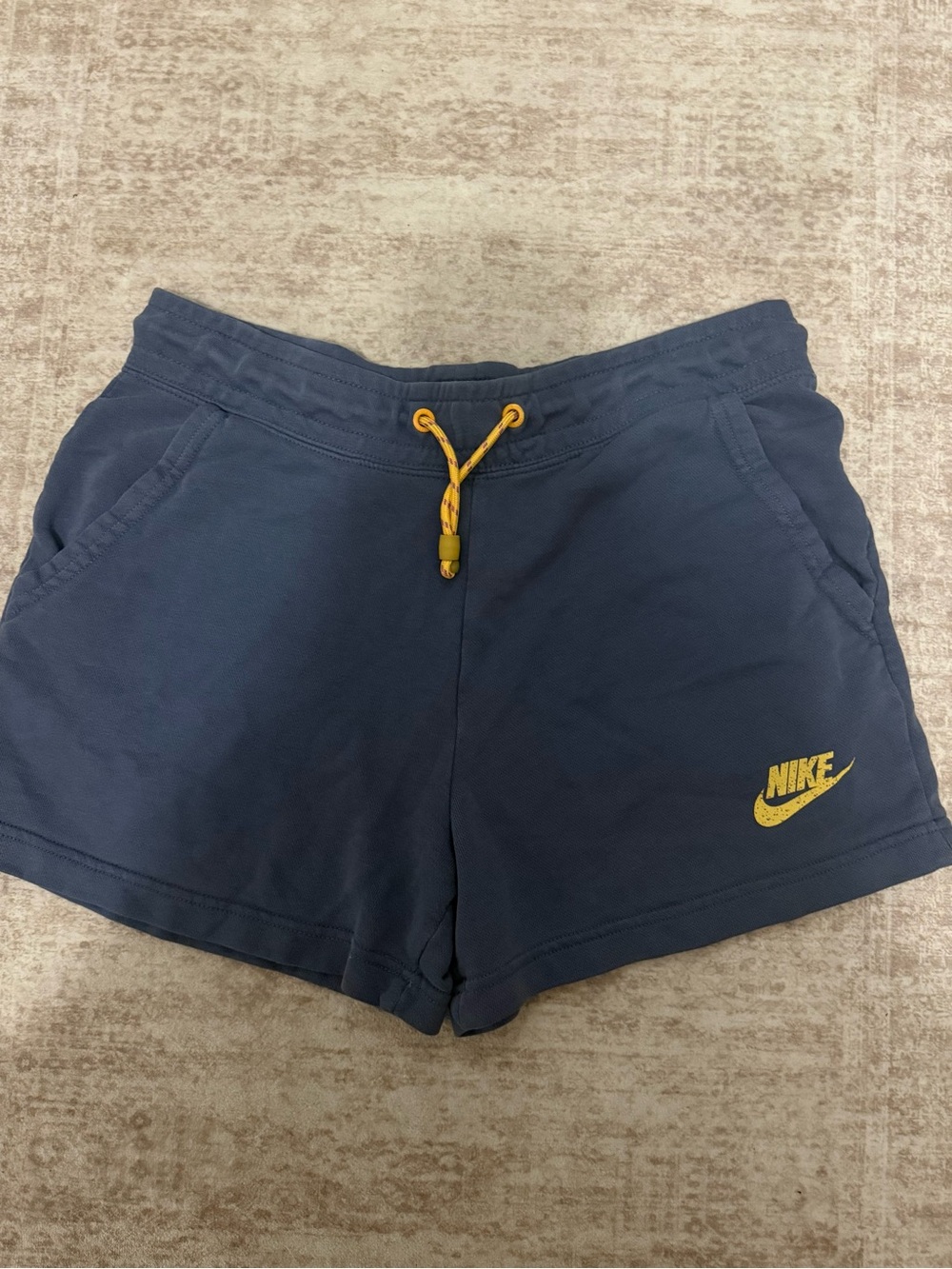 Nike Women's Navy Shorts with Yellow Drawstring and Logo